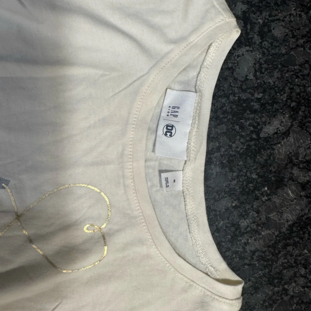 Like new GAP Cream Long Sleeve Shirt with Wonder Woman Design - Picture 3 of 4